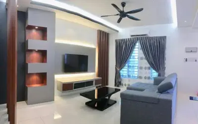 a living room with a couch and a flat screen tv at Homestay sweet dream in Gua Sai