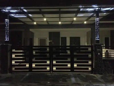 an empty arena with a gate and lights at Homestay sweet dream in Gua Sai