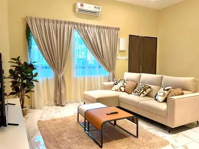 a living room with a couch and a table at Warm & Cozy Home in Kampong Duson Gilap