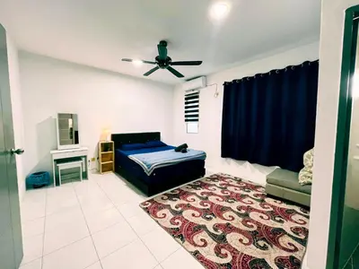 a bedroom with a bed and a ceiling fan at Homestay Sungai Petani 4 Bedroom in PRIMA Bandar Puteri Jaya by D'Aleena Homes in Sungai Petani