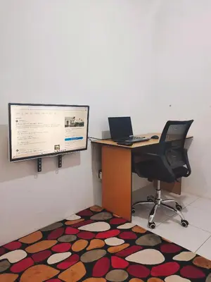 an office with a desk with a computer and a monitor at Homestay Sungai Petani 4 Bedroom in PRIMA Bandar Puteri Jaya by D'Aleena Homes in Sungai Petani