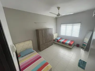 a bedroom with a bed and a cabinet and a window at MieMar Homestay Gopeng in Gopeng