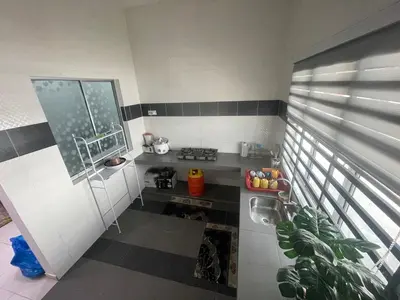 a small kitchen with a sink and a window at MieMar Homestay Gopeng in Gopeng