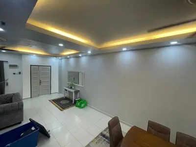 a living room with a couch and a table at MieMar Homestay Gopeng in Gopeng