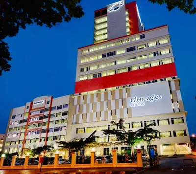 a tall building with a sign on the side of it at 12pax 3-Bedroom l Seaview l Georgetown l Gleneagles l Mansion One in George Town