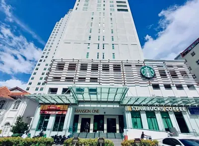 a tall white building with a clock on it at 12pax 3-Bedroom l Seaview l Georgetown l Gleneagles l Mansion One in George Town