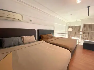 a bedroom with two beds in a room at Minimalist Balcony Duplex w Netflix at Bayan Lepas in Bayan Lepas