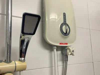 a water dispenser on a wall with at Minimalist Balcony Duplex w Netflix at Bayan Lepas in Bayan Lepas