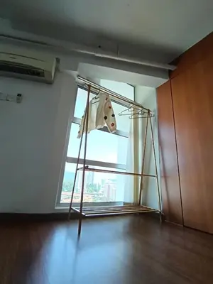 a dog is looking out of a window at Minimalist Balcony Duplex w Netflix at Bayan Lepas in Bayan Lepas