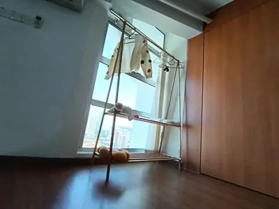 a towel rack in a room with a window at Minimalist Balcony Duplex w Netflix at Bayan Lepas in Bayan Lepas