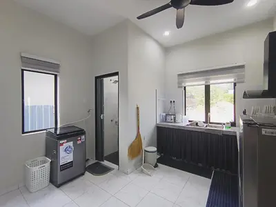 a kitchen with a sink and a ceiling fan at Homestay De'daun kulim mus'lim only in Kulim