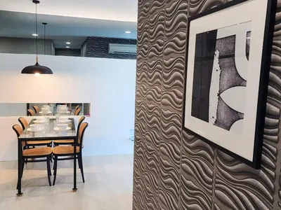 a dining room with a table and chairs at Stylish Living 2BR Suite in George Town
