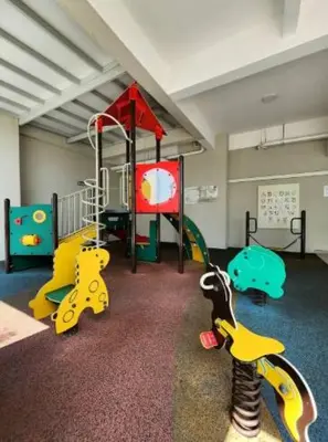 a childrens play room with a playground with toys at Stylish Living 2BR Suite in George Town