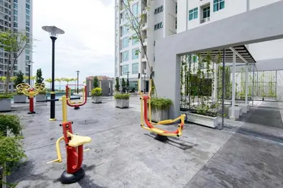 a group of yellow and red chairs in front of a building at Stylish Living 2BR Suite in George Town