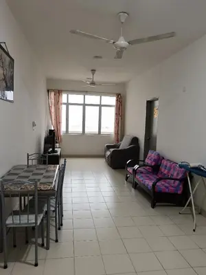 a living room with a couch and a table at Little sweet in Gua Sai