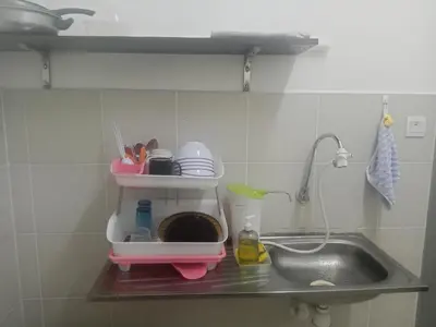 a kitchen counter with a sink and a mixer at Little sweet in Gua Sai