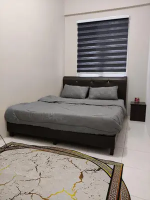a bed in a room with a window and a rug at Adila Alfina Heaven Homestay Cameron Highlands in Tanah Rata