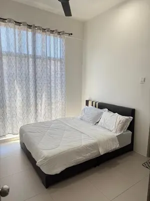 a bedroom with a bed with white sheets and a window at AYAAN Muslimah home at Golden Hill near Night Market in Brinchang