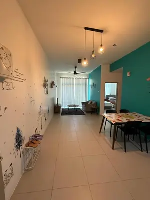 a dining room with a table and blue walls at AYAAN Tulip Golden Hills Home Near Night Market Free Parking in Brinchang