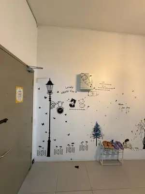 a room with a wall with drawings on it at AYAAN Tulip Golden Hills Home Near Night Market Free Parking in Brinchang