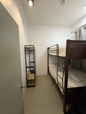 a hallway with two bunk beds in a room at AYAAN Tulip Golden Hills Home Near Night Market Free Parking in Brinchang