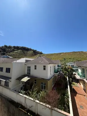 an aerial view of houses in a city at AYAAN Tulip Golden Hills Home Near Night Market Free Parking in Brinchang