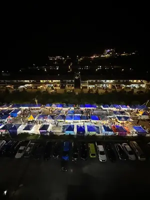 a large parking lot with a bunch of tents at AYAAN PENTHOUSE at Golden Hill Night Market View in Brinchang