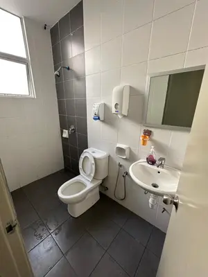 a bathroom with a toilet and a sink at AYAAN PENTHOUSE at Golden Hill Night Market View in Brinchang