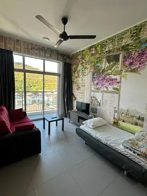 a bedroom with a bed and a couch and flowers on the wall at AYAAN Lavender Home at Golden Hills near Night Market in Brinchang