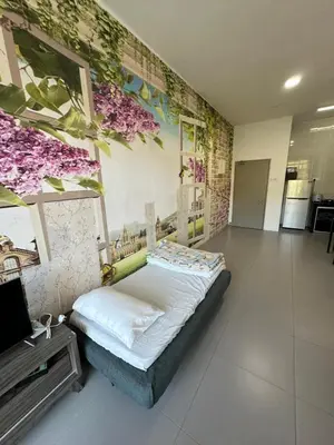 a bedroom with a bed and a wall with flowers at AYAAN Lavender Home at Golden Hills near Night Market in Brinchang