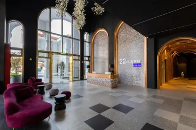 a lobby with purple chairs in a building at 22 Macalisterz in George Town