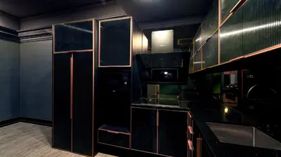 a kitchen with a black counter top and cabinets at 1969 D'Kelly Hotel in Ipoh