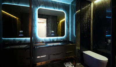 a bathroom with a sink and a mirror and a toilet at 1969 D'Kelly Hotel in Ipoh