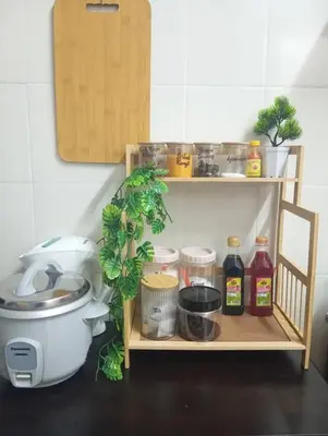 a shelf with food items on it in a kitchen at Auliya Homestay in Gua Sai