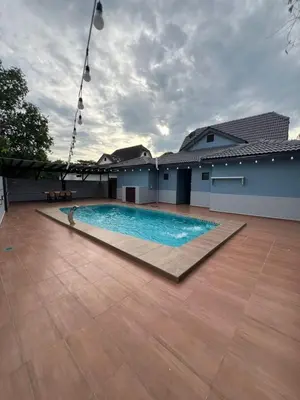 a large swimming pool in the middle of a building at Eiffel Villa Homestay Melaka in Gua Sai
