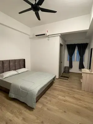 a bedroom with a bed and a ceiling fan at Wake Up Above The City Lights in Sitiawan