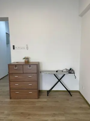 a table and a dresser in a room at Wake Up Above The City Lights in Sitiawan