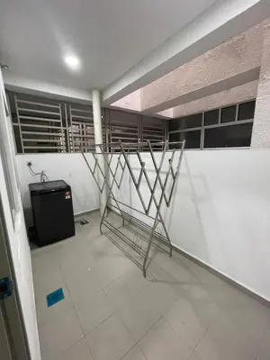 a room with a metal stand in the middle of a building at Wake Up Above The City Lights in Sitiawan