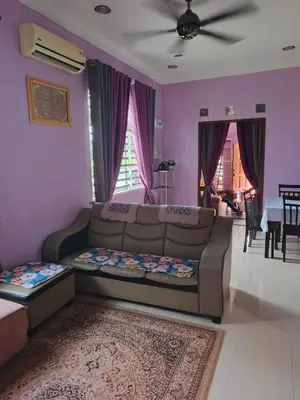 a living room with a couch and a table at Jannah homestay paddyview