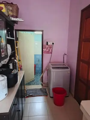 a kitchen with a washer and dryer in a room at Jannah homestay paddyview