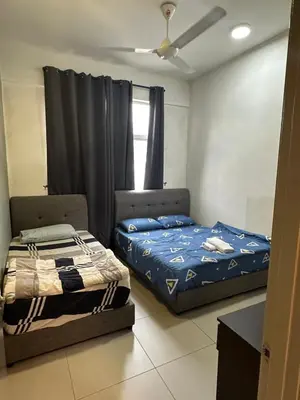 a bedroom with two beds and a window at AYAAN MARIGOLD at Golden Hills Night Market View in Brinchang