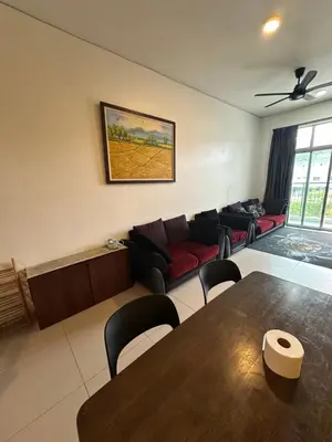 a living room with a table and a couch at AYAAN MARIGOLD at Golden Hills Night Market View in Brinchang