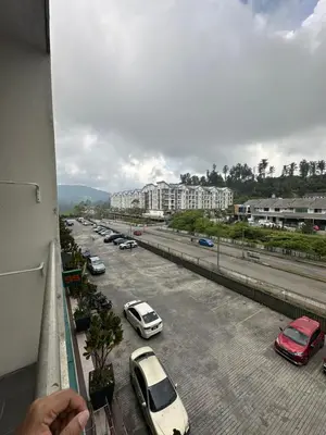 a view of a street with cars parked in a parking lot at AYAAN MARIGOLD at Golden Hills Night Market View in Brinchang