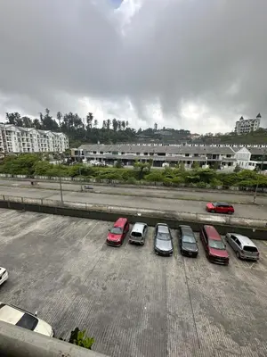 a group of cars parked in a parking lot at AYAAN MARIGOLD at Golden Hills Night Market View in Brinchang