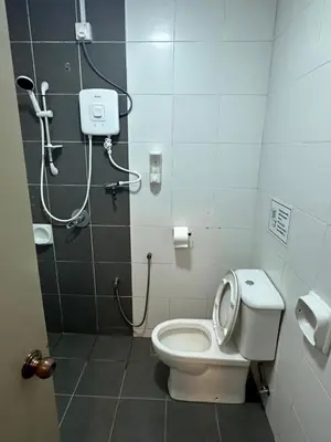 a bathroom with a toilet and a shower at AYAAN MARIGOLD at Golden Hills Night Market View in Brinchang