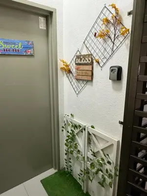 a stairway leading up to a door with a plant at AYAAN AURORA at Golden Hill Near Night Market and Free Parking in Brinchang