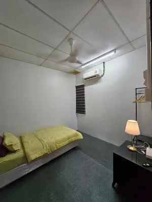 a bedroom with a bed in a room with a ceiling at Teratak Abah in Seri Manjung