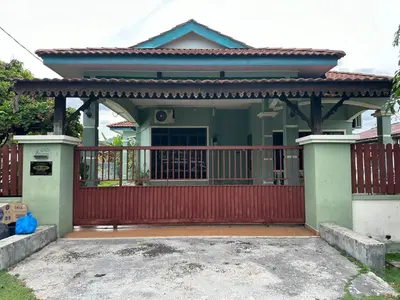 a house with a red gate in front of it at Homestay Manjoi - muslim2 in Ipoh