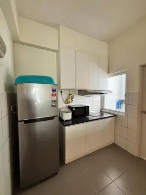 a kitchen with a stainless steel refrigerator and white cabinets at Pillow Talk HQ in Gua Sai