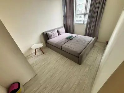 a small bedroom with a bed and a window at Pillow Talk HQ in Gua Sai
